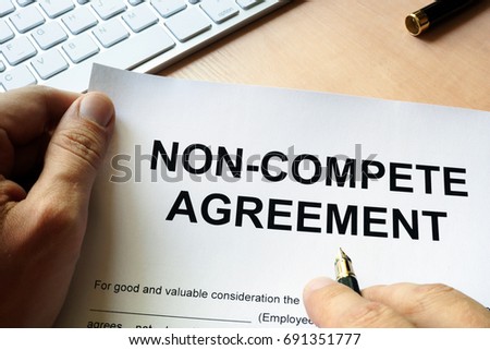 Man is signing Non compete agreement