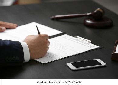Man signing power of attorney, closeup