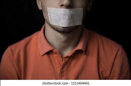 Man Is Silenced With Adhesive Tape On His Mouth.