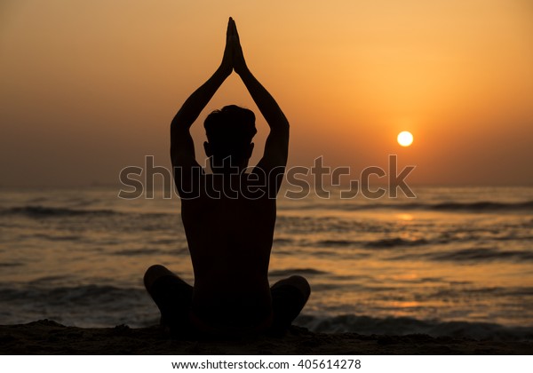 Man Silhouette Doing Yoga Exercise Sunset Stock Photo (Edit Now) 405614278