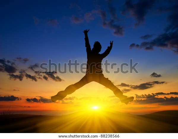 Man Silhouette Jumping On Sunset Background Stock Photo 88238566 ...