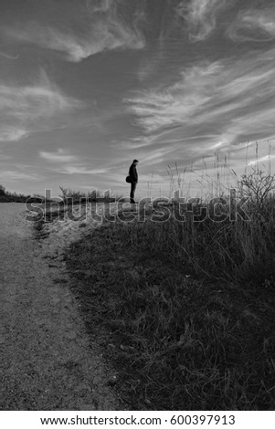 Similar – Man walking along the jetty