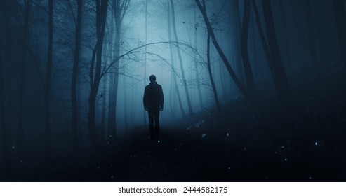  Man silhouette in mystic dark blue foggy forest. - Powered by Shutterstock