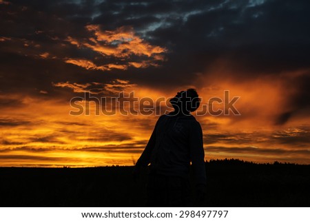 Man Silhouette on Sunset Background