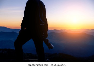 Man Silhouette Photographer take photo on hill high mountain