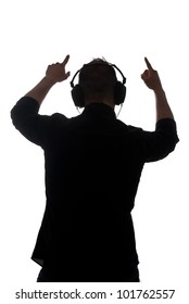 Man Silouette With Ear-phones Listening To Music Against White Background.