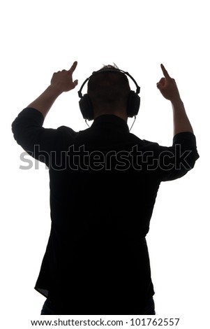 Man silouette with ear-phones listening to music against white background.