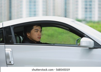 Man In Silver Car, Looking Away