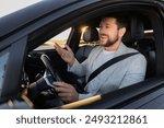 Man singing in car, view from outside