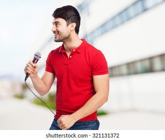 man singing with microphone