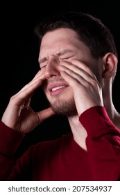 Man With Sinus Pain On Black Background