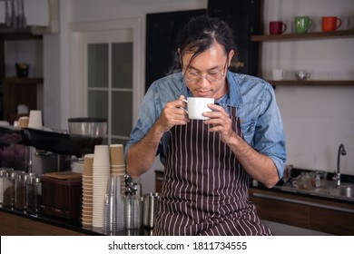 Man Sipping Hot  Coffee From Coffee Mug