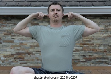 Man Siting In Half-lotus Practicing Bhramari, Humming Bee Breathing, Pranayama