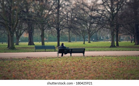 Man Sitting Alone On A Bench In The Park In London