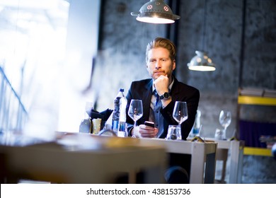 Man Sitting Alone At The Table In The Restaurant