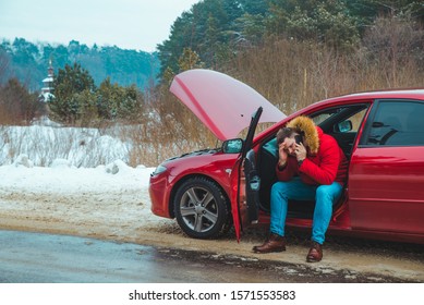 Man Sitting In Car Calling For Help. Break Down At Winter Speedway