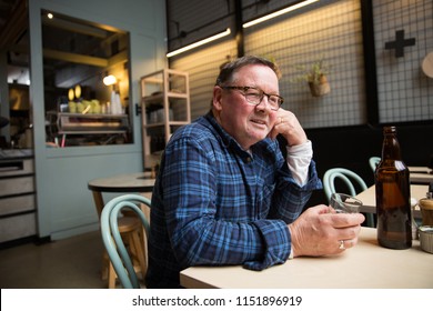Man Sitting in a Coffee Shop