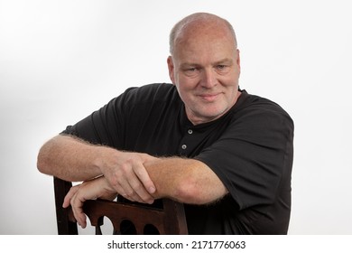 Man sitting down and looking into camera