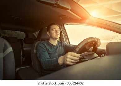 Man Sitting And Driving In The Car.