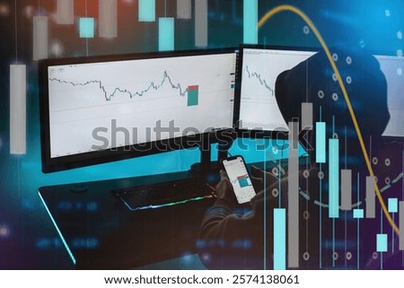A man sitting in front of his computer, and he is trading. Forex trader.