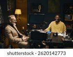 Man Sitting At Interview In Studio