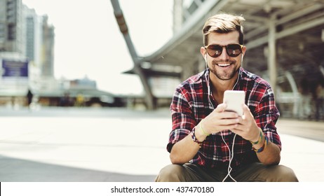 Man Sitting Listening Music Earphones Concept - Powered by Shutterstock