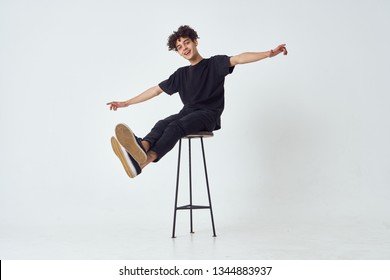   Man Sitting On A Bar Stool                             