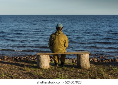 Man Sitting On Bench Overlooking Sea Stock Photo 524507923 | Shutterstock