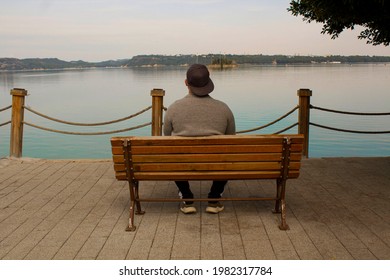 Man Sitting On Bench Watching Lake Stock Photo 1982317784 | Shutterstock