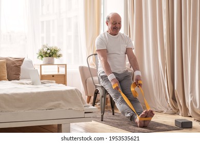 Man sitting on chair doing paschimottanasana or Intense Dorsal Stretch pose - Powered by Shutterstock