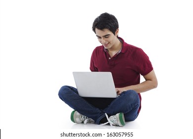 Man sitting on the floor and using a laptop