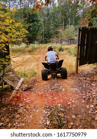 A Man Sitting On A Four Wheeler