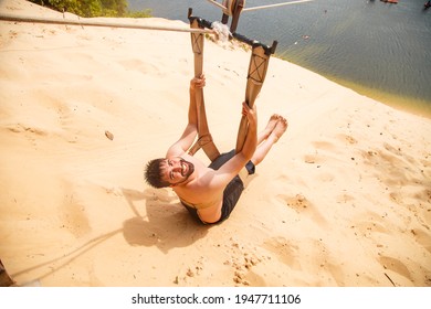 Man Sitting On Her Back And Looking Sideways On A Zip Line Overlooking The Jacomã Lagoon In The City Of Natal -RN 