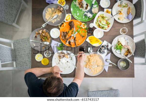 Man Sitting On Table Food Leftovers Stock Photo (Edit Now) 653743117