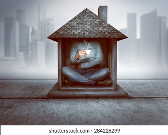 Man sitting in a tiny house