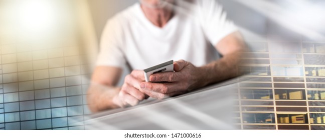 Man sitting using a smartphone; multiple exposure