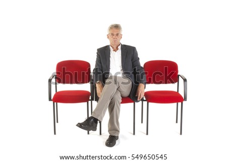Man sitting in waiting room isolated over white background