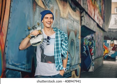 Man Skateboarder Lifestyle Relax. Listen music. Hipster Concept  - Powered by Shutterstock