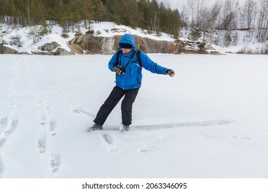 Man Skating On The Thin Ice. Dangerous Winter Activity.