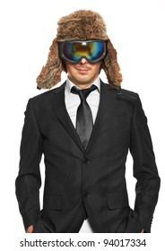 Man In Ski Goggles And Black Suit Standing, Isolated On White Background