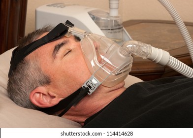 Man With Sleeping Apnea And CPAP Machine