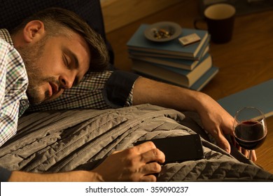 Man sleeping in bed after drinking wine