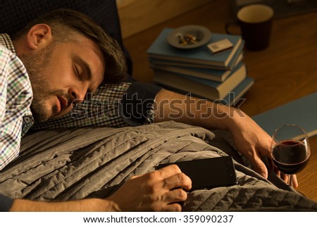 Man sleeping in bed after drinking wine