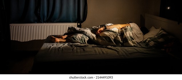 Man Sleeping In Bed At Night Sleep Quality  Insomnia