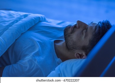 The Man Sleeping In The Bed. Night Time