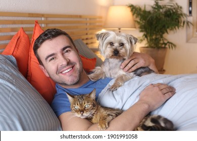 Man Sleeping With Cat And Dog 