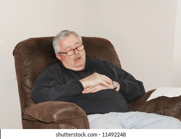 Man Sleeping In His Lounger Chair