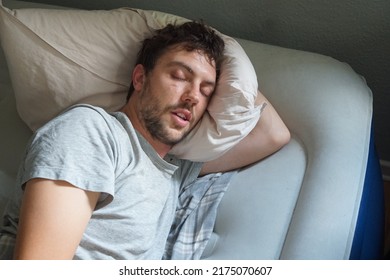 A Man Sleeping On A Blow Up Mattress