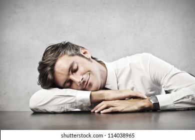 Man Sleeping On A Desk