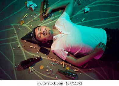 Man sleeping on the floor after party